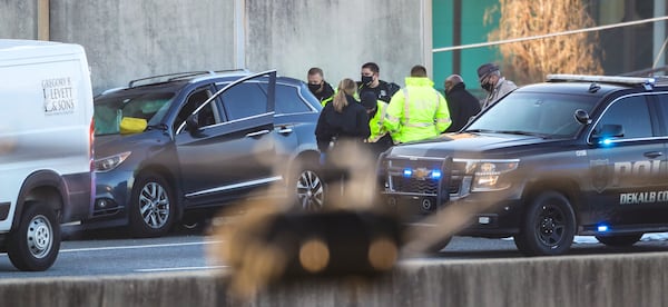 A man was shot to death inside a car on I-85 in DeKalb County on Jan. 21, 2021, prompting an investigation that closed the interstate for hours. (JOHN SPINK / John.Spink@ajc.com)

