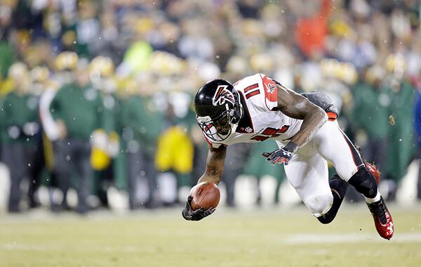 Atlanta Falcons' Julio Jones after a catch during the first half of an NFL football game against the Green Bay Packers Monday, Dec. 8, 2014, in Green Bay, Wis. (AP Photo/Tom Lynn)