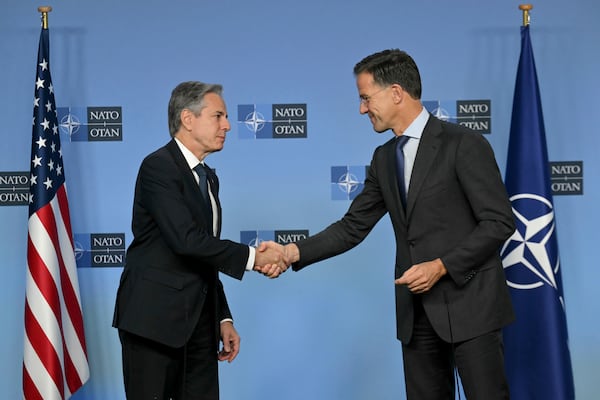 NATO Secretary General Mark Rutte, right, shake hands with United States Secretary of State Antony Blinken prior to a meeting at NATO headquarters in Brussels, Wednesday, Nov. 13, 2024. (Nicolas Tucat, Pool Photo via AP)