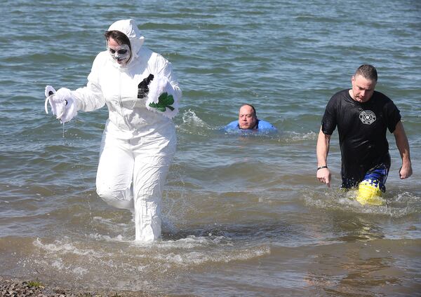 City, county and community leaders jump in an ice cold lake to raise money for Big Brothers Big Sisters during the first ever Polar Bear Plunge at the Clark County Fairgrounds lake Thursday. Bill Lackey/Staff