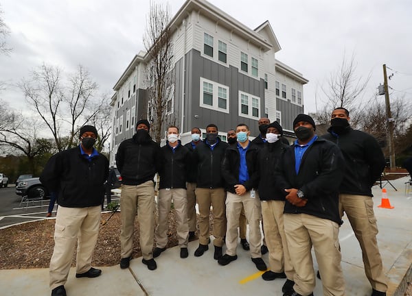 The recently recruited APD class 274 arrive for the ribbon cutting of Unity Place, an apartment complex for Atlanta police recruits in the English Avenue neighborhood. (Curtis Compton / Curtis.Compton@ajc.com)