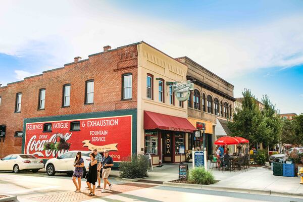 Shoppers and historic buildings on Main Street in Hendersonville, NC. 
(Courtesy of: Tim Robison)