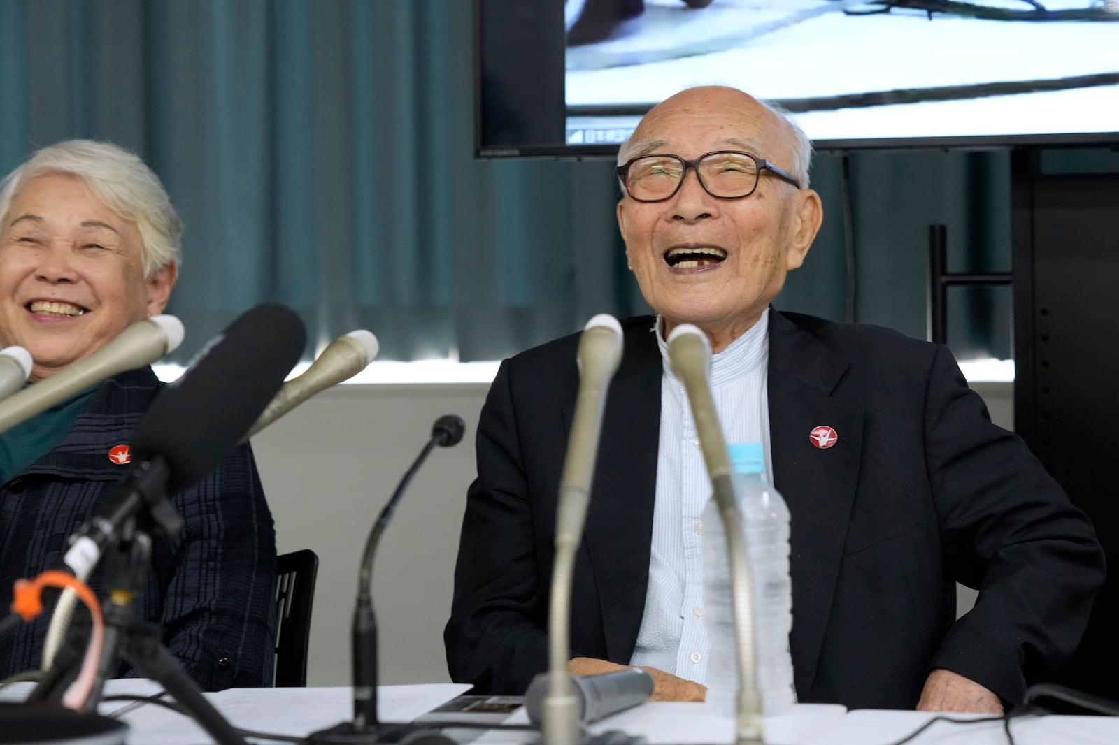 Terumi Tanaka, right, co-chairperson of Nihon Hidankyo and assistant Secretary General Toshiko Hamanaka smile during a press conference in Tokyo, Saturday, Oct. 12, 2024, a day after Nihon Hidankyo, or the Japan Confederation of A- and H-Bomb Sufferers Organizations, won the Nobel Peace Prize. (AP Photo/Hiro Komae)