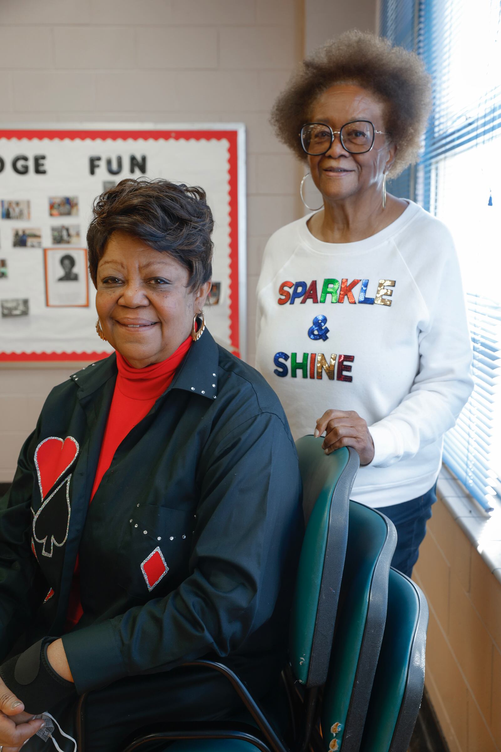 Delores Turner (left) and her bridge partner Elaine McCray were good-naturedly ribbed for being too chatty during a recent game.  (Natrice Miller/natrice.miller@ajc.com)