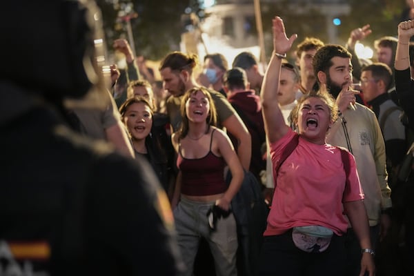 Demonstrators gather for a protest organized by social and civic groups, denouncing the handling of recent flooding under the slogan "Mazón, Resign," aimed at the president of the regional government Carlos Mazon, in Valencia, Spain, Saturday, Nov. 9, 2024. (AP Photo/Emilio Morenatti)