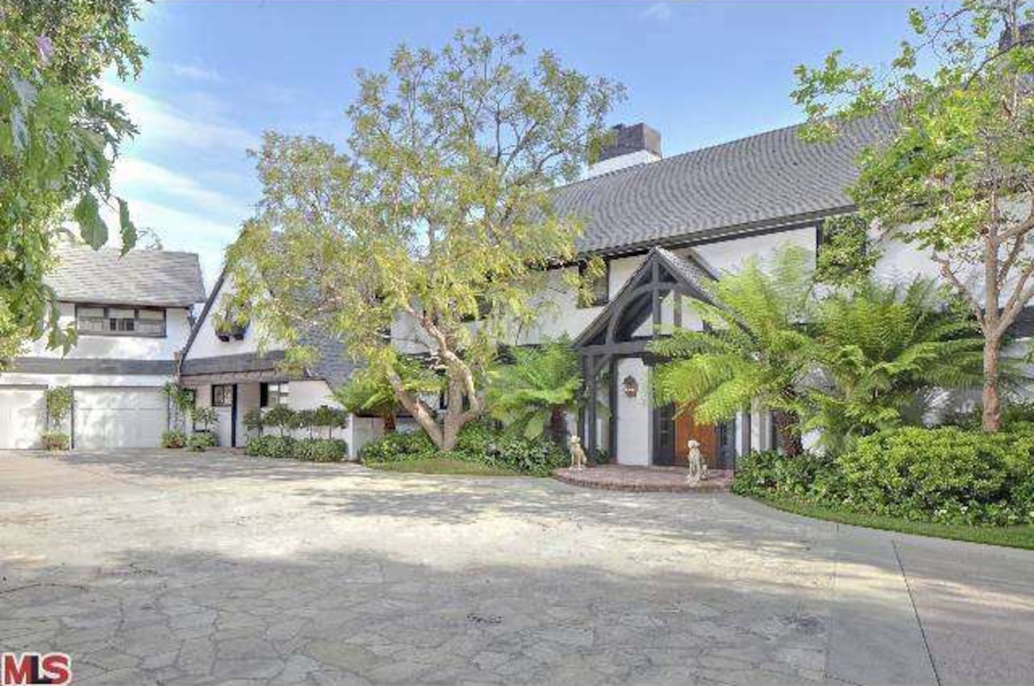 Property includes Mediterranean-style home, lagoon pool