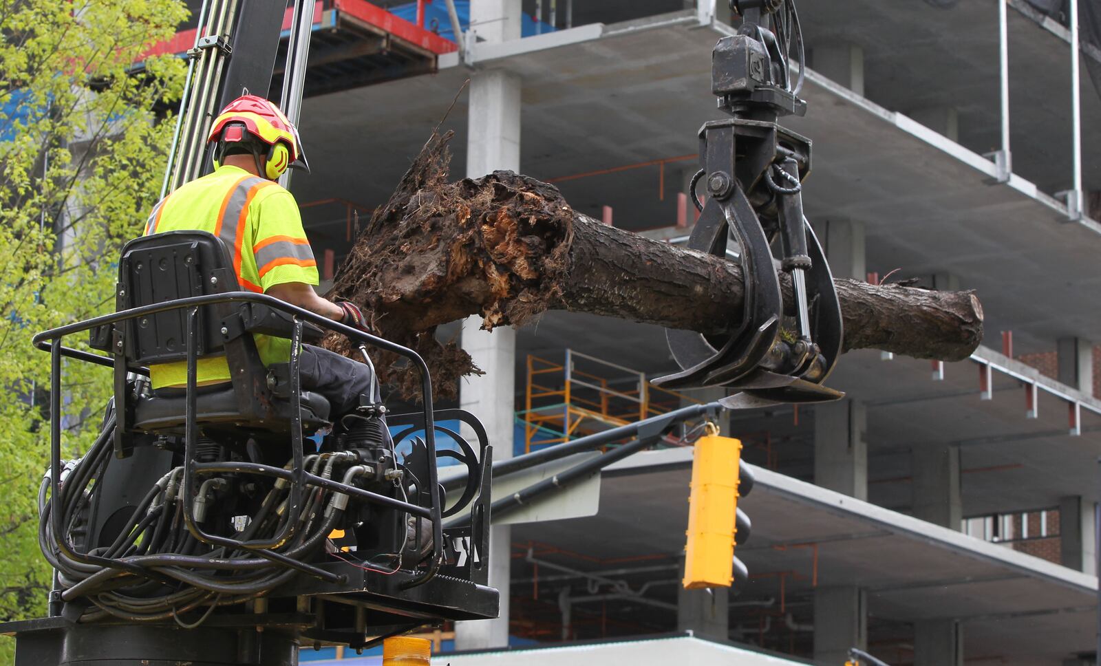 A tree fell on top of a van in downtown Atlanta on Monday. HENRY TAYLOR / HENRY.TAYLOR@AJC.COM