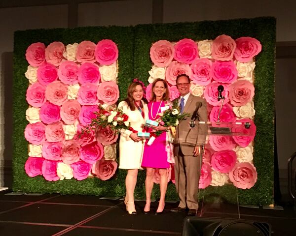  Atlanta Humane Society president Cal Morgan salutes Lisa Fuller, left, and Kay Quigley. Photo: Wendy Foulke