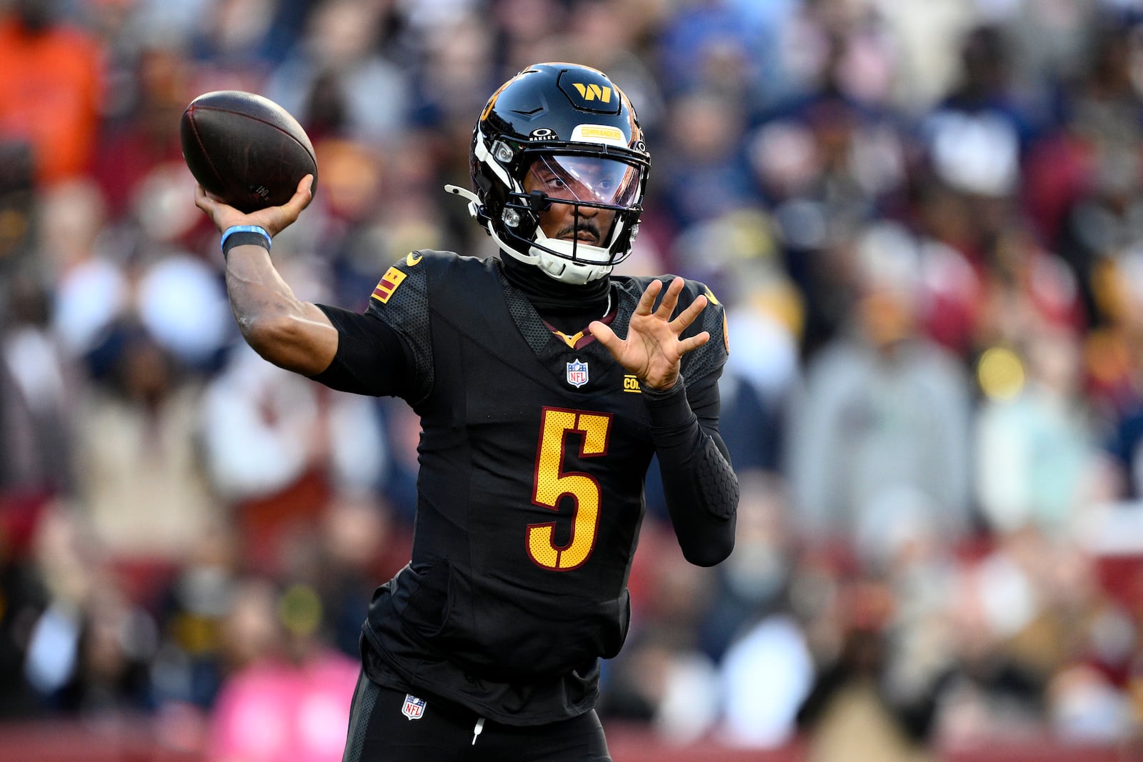 Washington Commanders quarterback Jayden Daniels passes against the Chicago Bears in the first half of an NFL football game Sunday, Oct. 27, 2024, in Landover, Md. (AP Photo/Nick Wass)