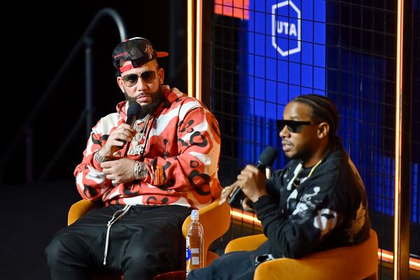 Grammy winners DJ Drama, co-founder of Generation Now, and Kawan "KP the Great" Prather, head of music at iamOTHER, discuss how music producers take center stage at UNLOQ404 at Overtime Elite Arena on October 14, 2023 in Atlanta, Georgia. (Photo by Derek White/Getty Images for UTA)