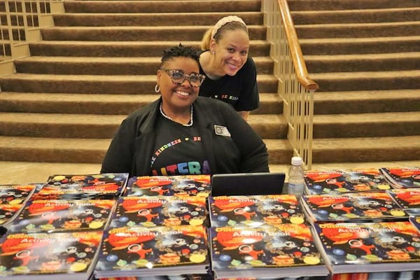 Students received signed copies of “Dusko Goes to Space” to add to their personal home libraries. (Courtesy of Clayton News-Daily)