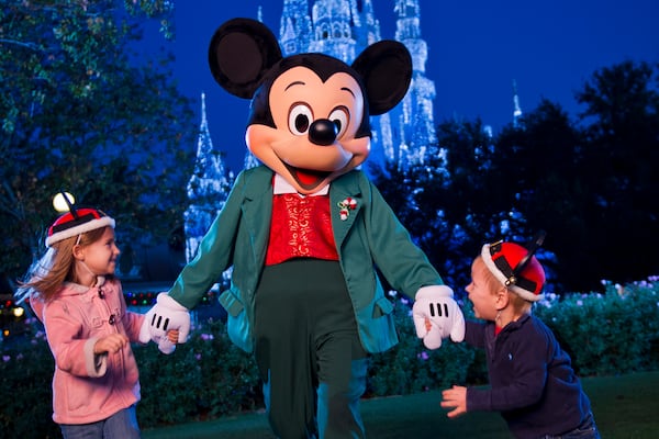 Mickey Mouse presides over the holiday festivities during Mickey's Very Merry Christmas Party at Magic Kingdom in Lake Buena Vista, Fla. This enchanting after-hours party showcases special entertainment, including "Mickey's Once Upon a Christmastime Parade" and a holiday edition of the fireworks spectacular "Wishes," as well as meet-and-greet opportunities with favorite Disney characters in holiday attire. (Matt Stroshane, photographer)