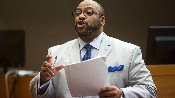 Fulton County Chief Assistant District Attorney Clint Rucker talks to jurors Friday. STEVE SCHAEFER / SPECIAL TO THE AJC