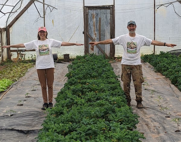 Cotton Mill Farmers Market manager Wendy Crager and her husband Bryan Hager practice social distancing (6 feet = roughly two arm’s length apart) at Crager-Hager Farm in Carroll County. CONTRIBUTED BY PATRICK DOST