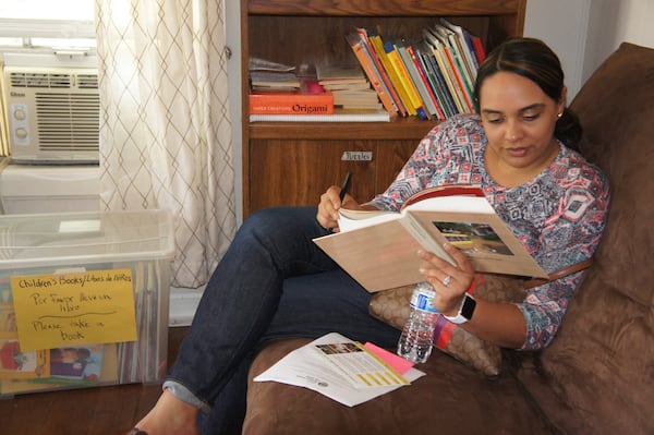 Laura Mercado relaxes in the living room at El Refugio. She drove down from North Augusta, South Carolina, with a friend to visit the friend’s son at Stewart Detention Center. CONTRIBUTED BY STELL SIMONTON