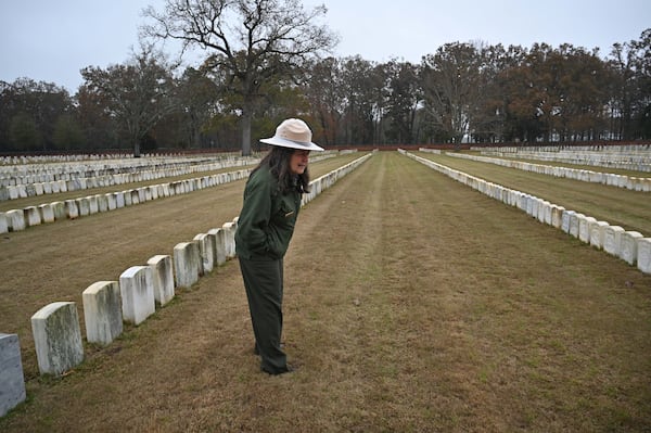 Gia Wagner, superintendent of the Andersonville National Historic Site, visited some of the graves of Irish Americans at the cemetery in November. "The discovery and sharing of these Irish American stories will allow all Americans, and especially Irish Americans, to learn about themselves, the drivers of Irish immigration prior to 1864, and the experiences of prisoners of war," she said.  (Hyosub Shin / Hyosub.Shin@ajc.com)