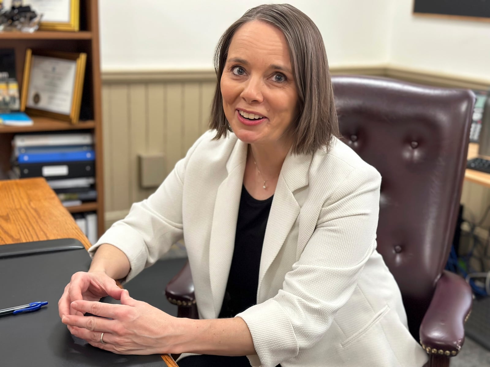 FILE - Maine Democratic Secretary of State Shenna Bellows speaks with an aide in her office after the House voted down an attempt to impeach her on Tuesday, Jan. 9, 2024, in Augusta, Maine. (AP Photo/David Sharp, File)