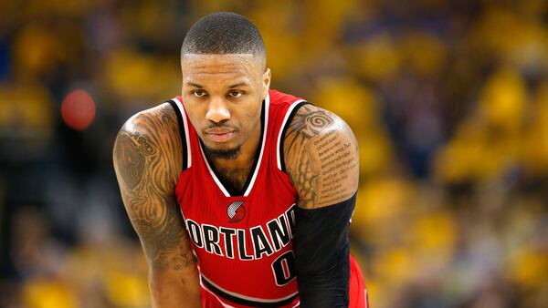 Portland's Damian Lillard  has 22 lines of the Psalm 37 tattooed on his left arm.