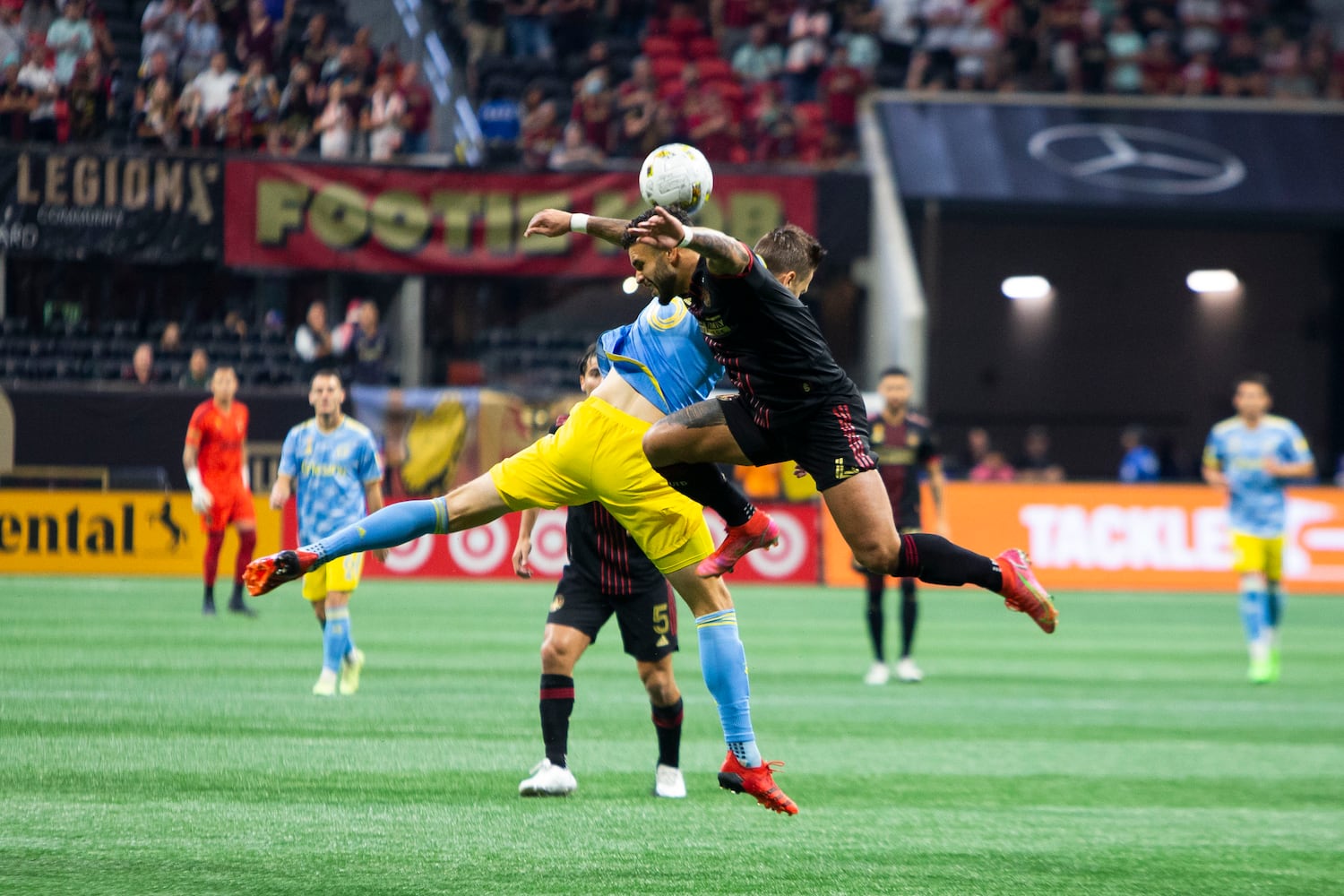 Dom Dwyer (right), forward for Atlanta United, and Philadelphia Union defender Jack Elliott (left) go for a header. CHRISTINA MATACOTTA FOR THE ATLANTA JOURNAL-CONSTITUTION.