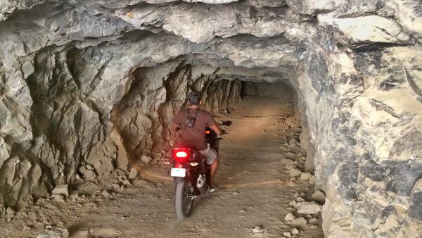 Abhi Eswarappa is keen to discover how far he could ride into the abandoned Reward mine. Answer? Far enough to get spooked. (Charles Fleming/Los Angeles Times/TNS)