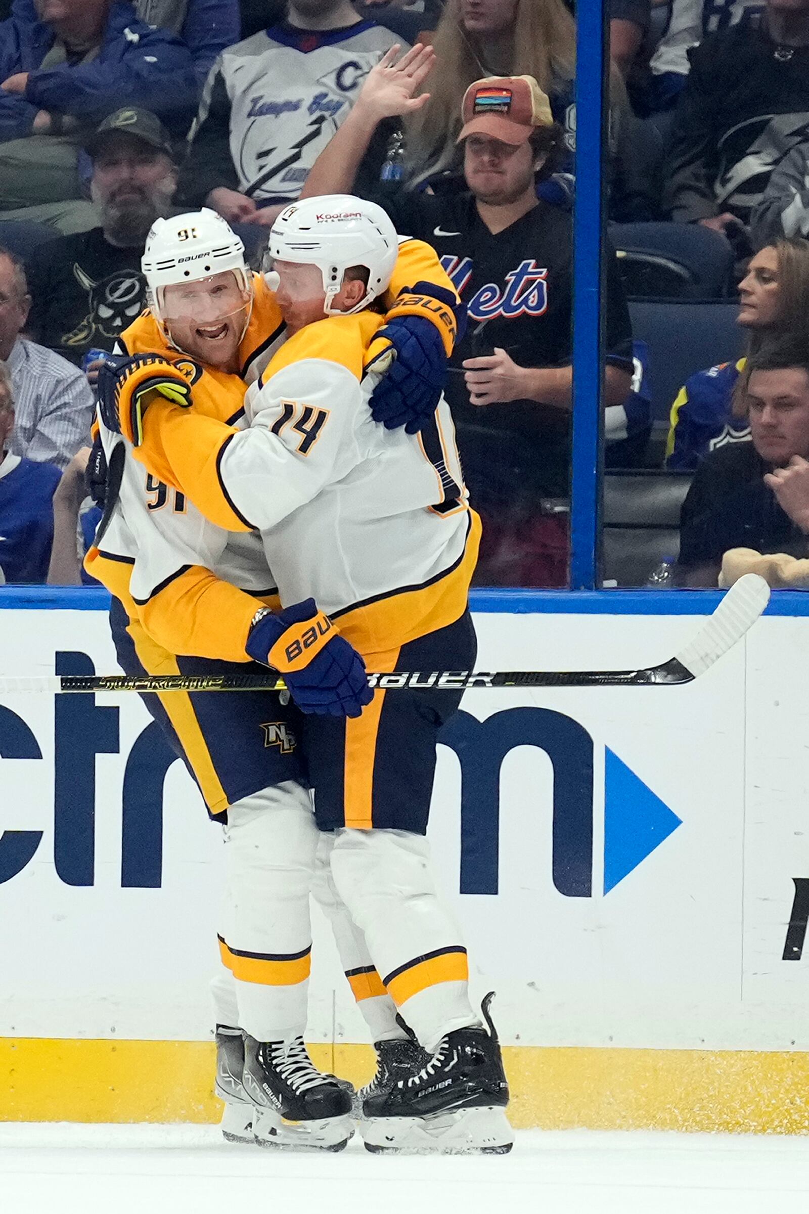 Nashville Predators center Gustav Nyquist (14) celebrates his goal against the Tampa Bay Lightning with center Steven Stamkos (91) during the second period of an NHL hockey game Monday, Oct. 28, 2024, in Tampa, Fla. (AP Photo/Chris O'Meara)