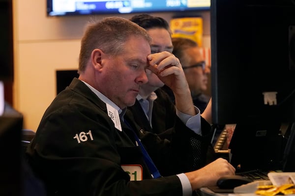 Traders work on the floor of the New York Stock Exchange, Tuesday, March 11, 2025. (AP Photo/Richard Drew)