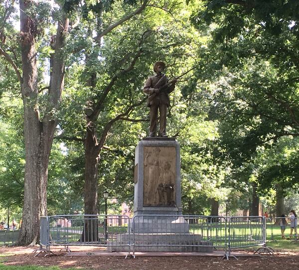 Protestors demand the removal of "Silent Sam," a statue placed in memory of Confederate soldiers on the University of North Carolina campus. Photo: Jennifer Brett