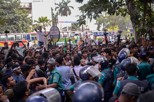 Policemen try to stop Bangladesh Nationalist Party activists marching near prime minister Sheikh Hassan's Awami League party office in Dhaka, Bangladesh, Sunday, Nov. 10, 2024. (AP Photo/Mahmud Hossain Opu)