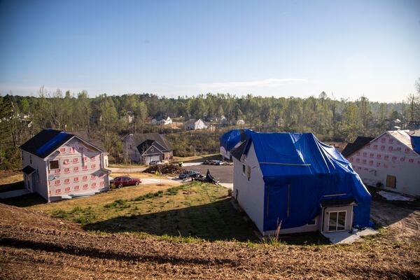 Homes in this neighborhood of Newnan suffered busted windows, damaged roofs and a loss of siding from the March tornado. The twister wiped out 70 homes and damaged nearly 1,700 others. (Alyssa Pointer / Alyssa.Pointer@ajc.com)