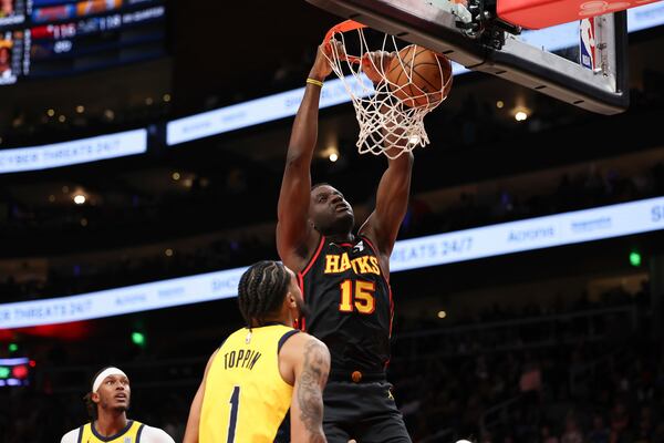 Atlanta Hawks center Clint Capela (15) dunks the basketball against Indiana Pacers forward Obi Toppin (1) in the second half of an NBA basketball game, Thursday, March 6, 2025, in Atlanta. (AP Photo/Colin Hubbard)