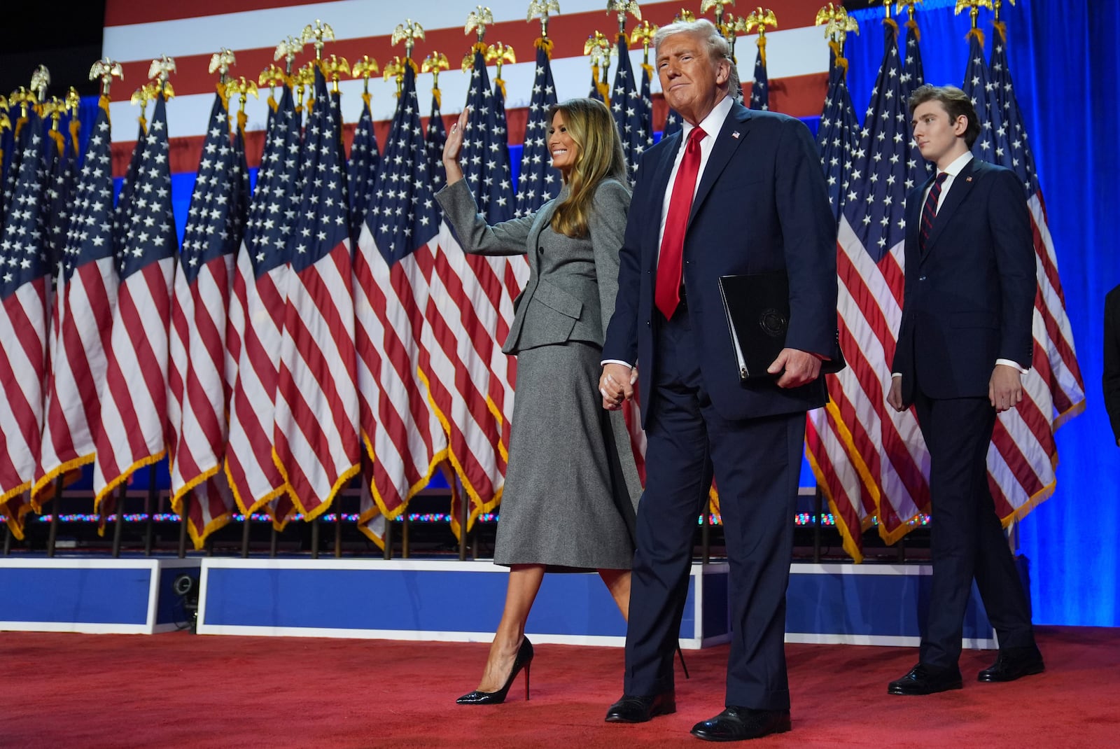 Republican presidential nominee former President Donald Trump, Melania Trump and Barron Trump, arrive to speaks at an election night watch party, Wednesday, Nov. 6, 2024, in West Palm Beach, Fla. (AP Photo/Evan Vucci)