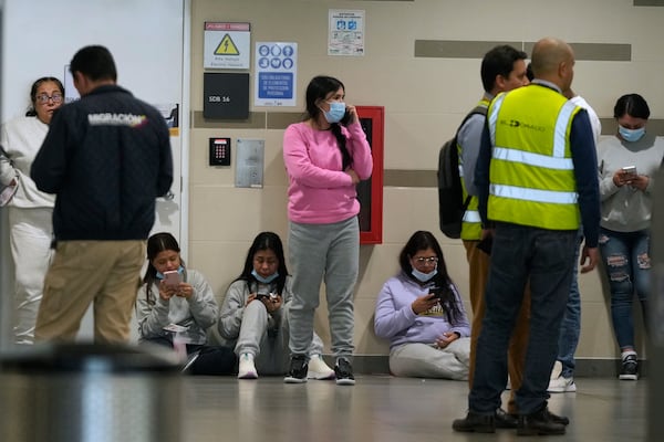 Colombian migrants deported from the United States wait inside El Dorado airport after arriving in Bogota, Colombia, Tuesday, Jan. 28, 2025. (AP Photo/Fernando Vergara)