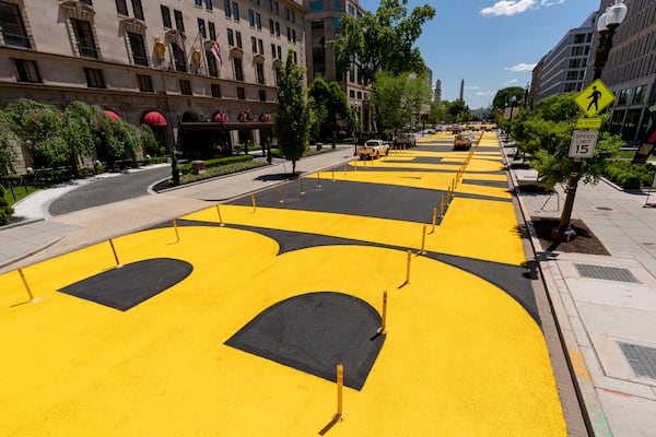 FILE - The letters at Black Lives Matter Plaza have been repainted after the street was repaved near the White House in Washington, May 13, 2021. (AP Photo/Andrew Harnik, file)