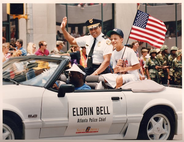 Eldrin Bell, former police chief of Atlanta,  with his son,Justin Guarini, a contestant on "American Idol," at a Fourth of July parade in the early 1990s. (Photo courtesy of Eldrin Bell.)