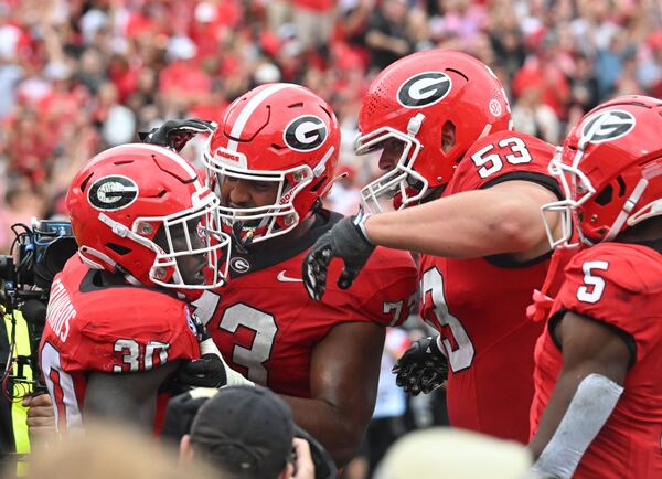 Georgia's running back Daijun Edwards (30) celebrates with teammates after scoring a touchdown during the second half in an NCAA football game at Sanford Stadium, Saturday, September 16, 2023, in Athens. Georgia won 24 - 14 over South Carolina. (Hyosub Shin / Hyosub.Shin@ajc.com)