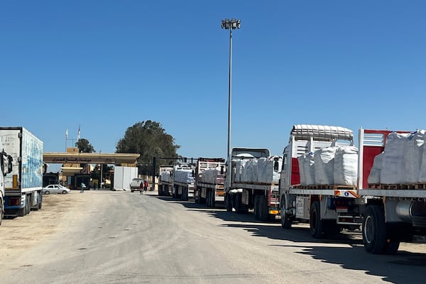 Trucks line up at the Egyptian side of the Rafah border crossing between Egypt and the Gaza Strip on Sunday, March 2, 2025. (AP Photo/Mohamed Arafat)