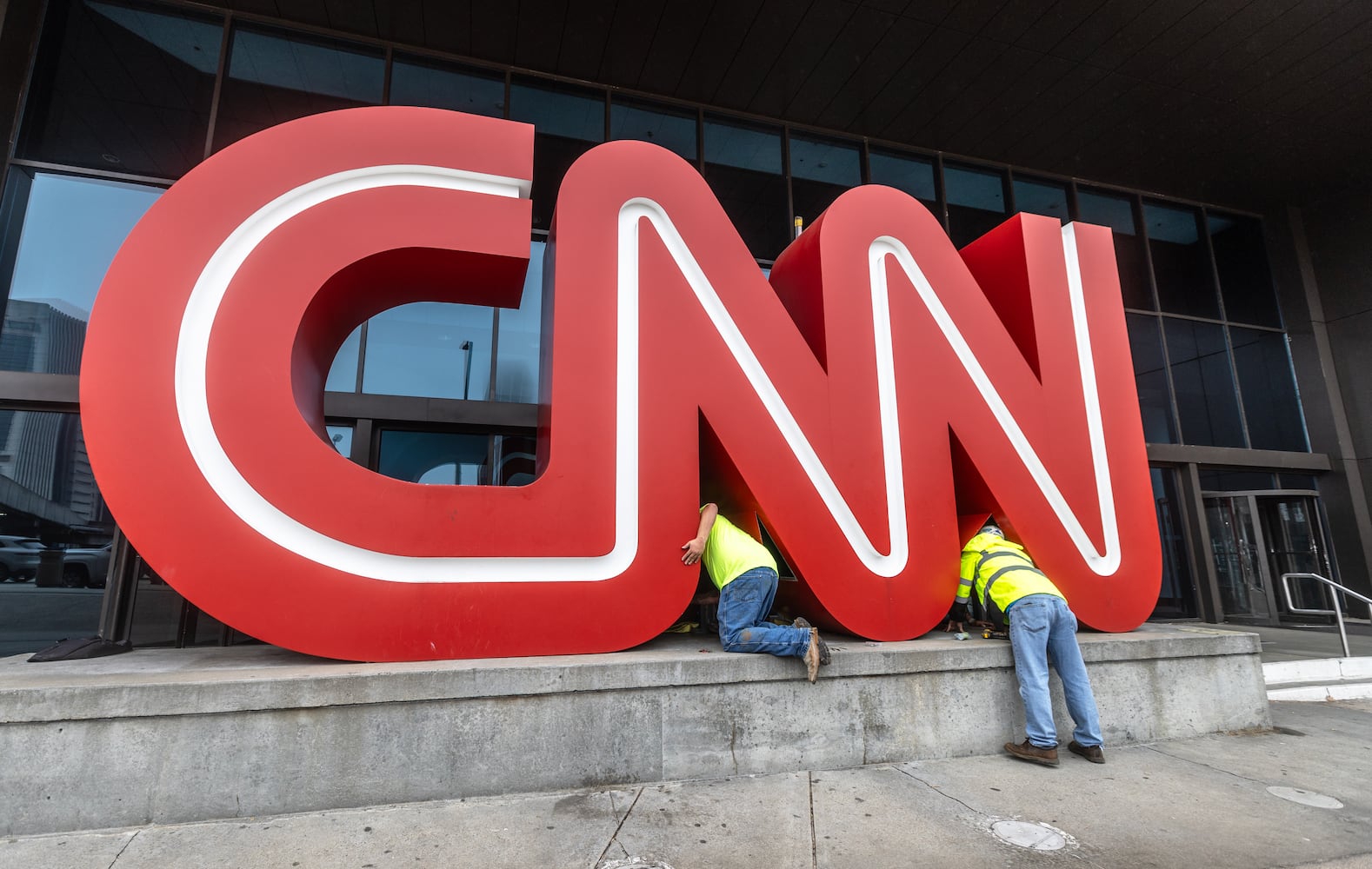 The CNN sign in front of the CNN Center along Centennial Olympic Park Drive in downtown Atlanta was dismantled and moved to Turner Broadcasting on Monday, March, 4, 2024.  (John Spink / John.Spink@ajc.com)

