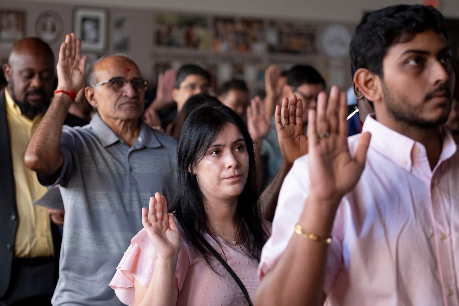 People take the oath of allegiance during a Naturalization ceremony at Jimmy Carter National Historic Park in Plains on Tuesday, Oct. 1, 2024. The ceremony was held in honor of President Carter’s 100th birthday.  Ben Gray for the Atlanta Journal-Constitution