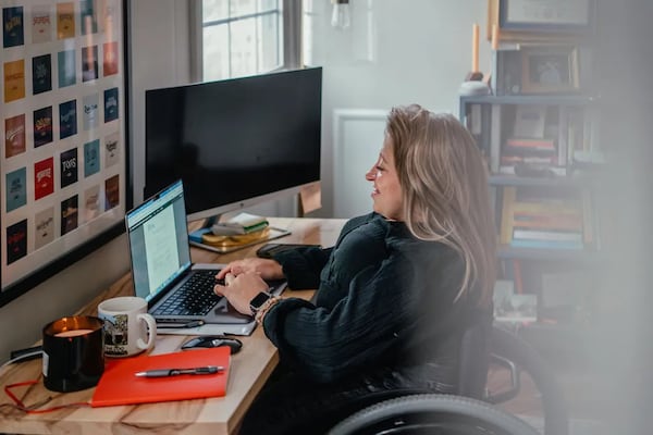 Emily Voorde works in her home office on February 7, 2024 in South Bend, Indiana. (Photo Courtesy of Jamie Kelter Davis, The 19th)