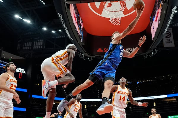 Orlando Magic forward Franz Wagner (22) shoots against against the Atlanta Hawks during the first half of an NBA basketball game, Thursday, Feb. 20, 2025, in Atlanta. (AP Photo/Mike Stewart)