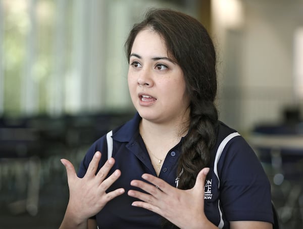 Carolina Gomez, 25, is a senior at Dalton State College. Her family moved to Dalton to work in the area’s textile mills. Gomez is president of the student government association at the college, where Hispanic immigrants and children of immigrants are excelling and graduating at rates exceeding that of other groups. Bob Andres / bandres@ajc.com