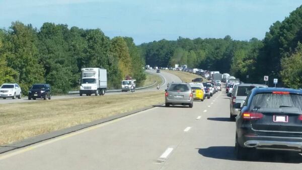 A tour bus and a tractor-trailer crashed Wednesday in Gilmer County. (Credit: Channel 2 Action News)