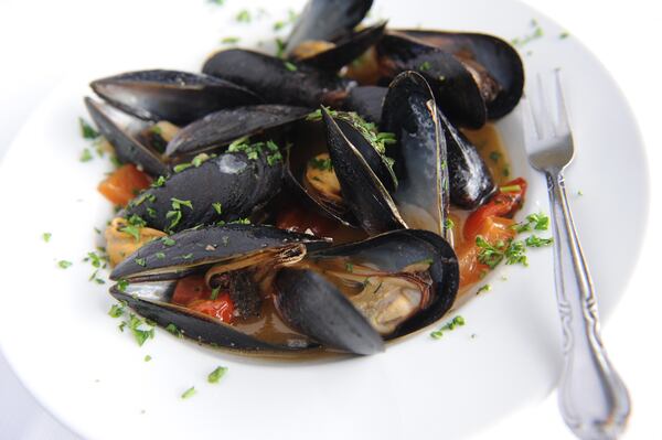 Mussels alla Tarantina- in garlic oil and white wine sauce(in image) or marinara sauce. (BECKY STEIN PHOTOGRAPHY)