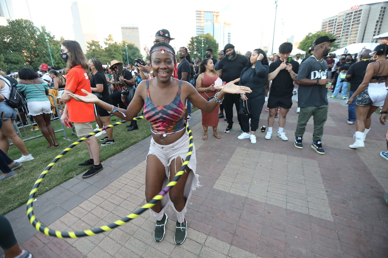 Lauren Povonia from Atlanta found a way to enjoy herself dancing with the hula hoop. Sunday, October 10, 2021. Miguel Martinez for The Atlanta Journal-Constitution