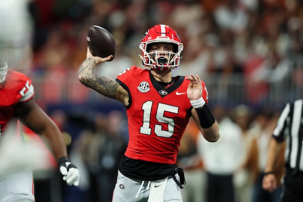 Georgia quarterback Carson Beck (15) attempts a pass during the second quarter against Texas in the 2024 SEC Championship game at Mercedes-Benz Stadium, Saturday, December 7, 2024, in Atlanta. Jason Getz / AJC)
