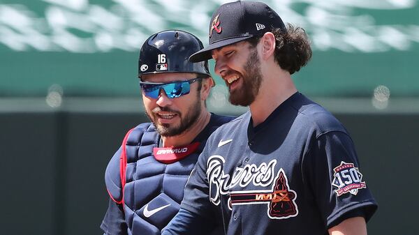 Atlanta Braves starting pitcher Ian Anderson (foreground) and catcher Travis d’Arnaud are all smiles after Anderson's two scoreless innings of a 6-0 shutout of the Minnesota Twins Tuesday, March 2, 2021, at CoolToday Park in North Port, Fla. (Curtis Compton / Curtis.Compton@ajc.com)