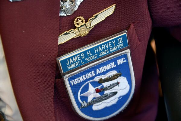 101-year-old Col. James H. Harvey III, one of the last surviving Tuskegee Airmen, wears a jacket adorned with pins and patches at the Veterans Community Living Center in Aurora, Colo., Wednesday, March 12, 2025. (AP Photo/Thomas Peipert)