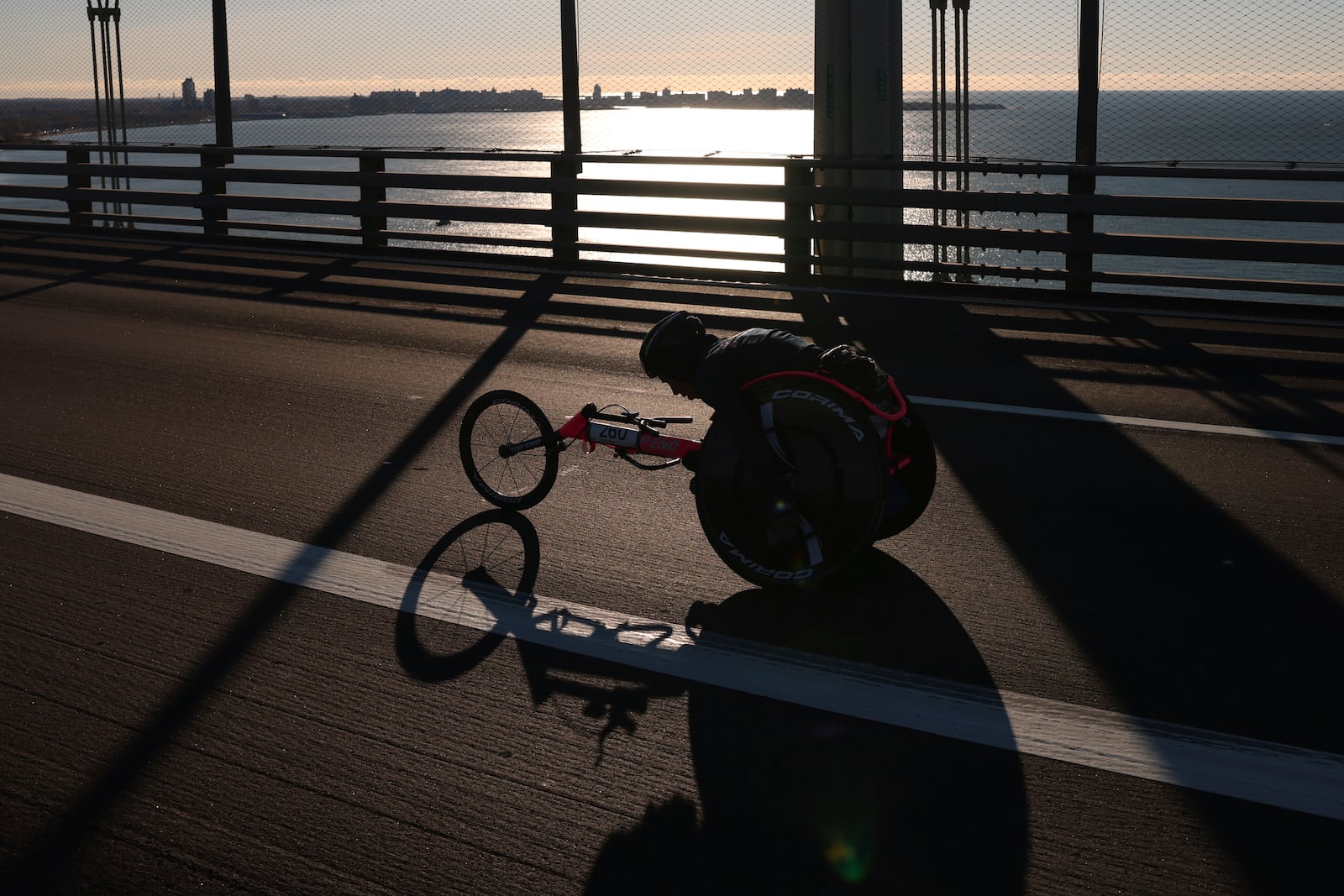 A competitor in the men's wheelchair division makes his way across the Verrazzano Narrows Bridge during the New York City Marathon, Sunday, Nov. 3, 2024, in New York. (AP Photo/Yuki Iwamura)