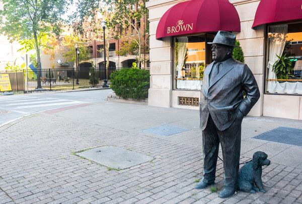 A statue of founder J. Graham Brown and his beloved poodle Woozem outside the Brown Hotel in Louisville, Kentucky. (Bill Dawers for The Atlanta Journal-Constitution)