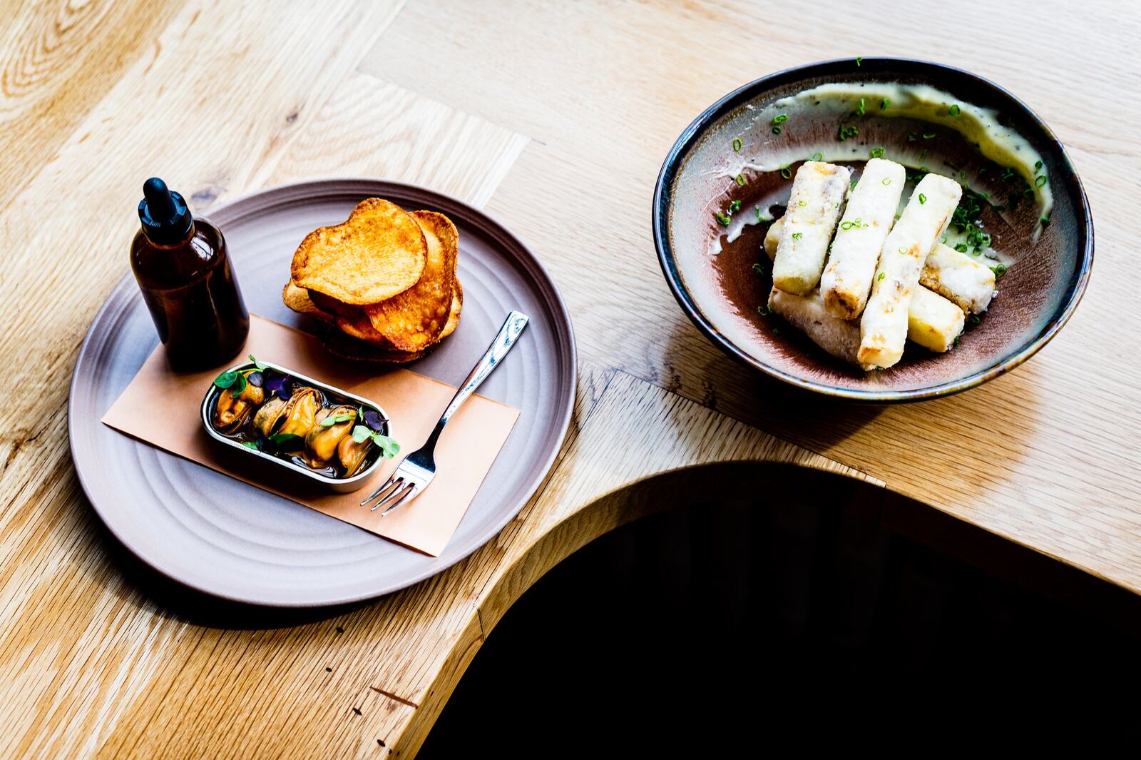 Chilled Mussels en Escabeche (left) and Crispy Eggplant are great ways to start a meal at Redbird. 